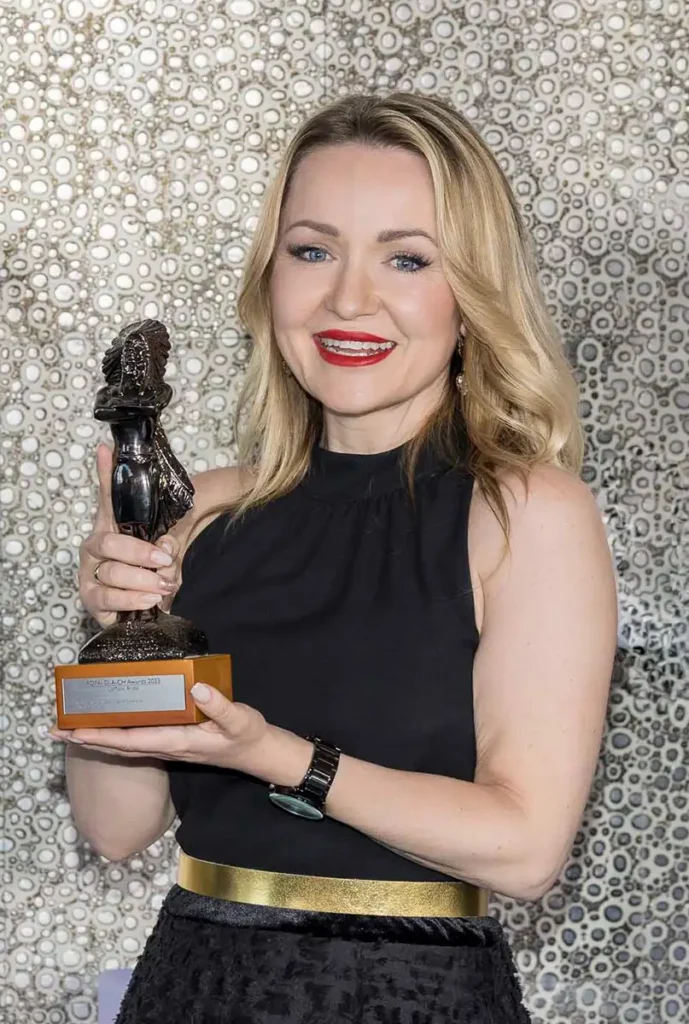 Lena Moos from LeMoos with an award.